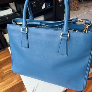Authentic pre-loved Lux Galleria double zip closure tote.